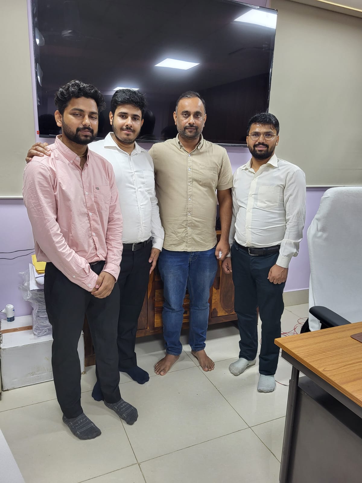 Lab members posing together in the IMPACT Lab office